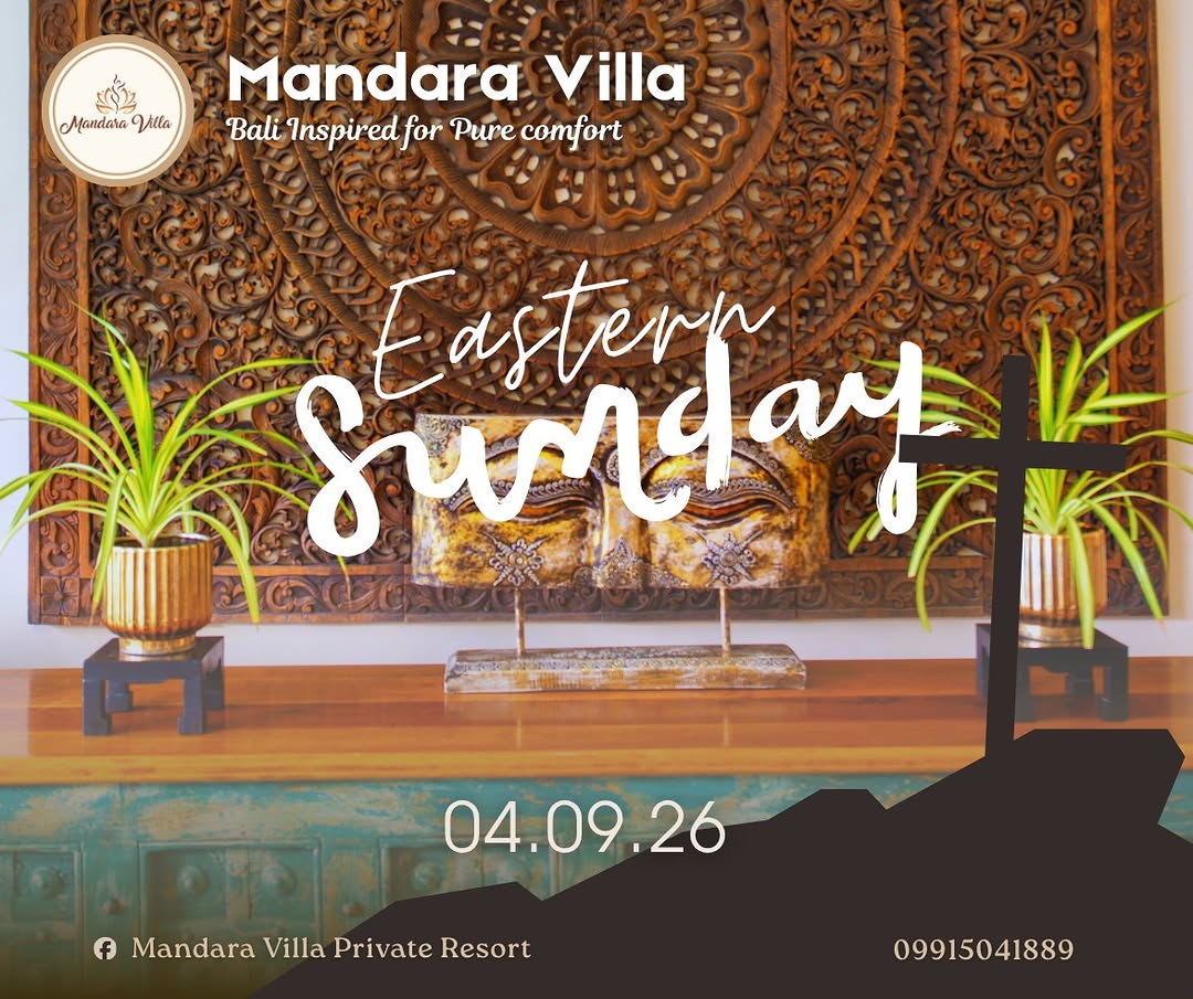Interior Balinese decor detail — intricate carved wood mandala wall panel, golden Buddha head statue, and tropical plants